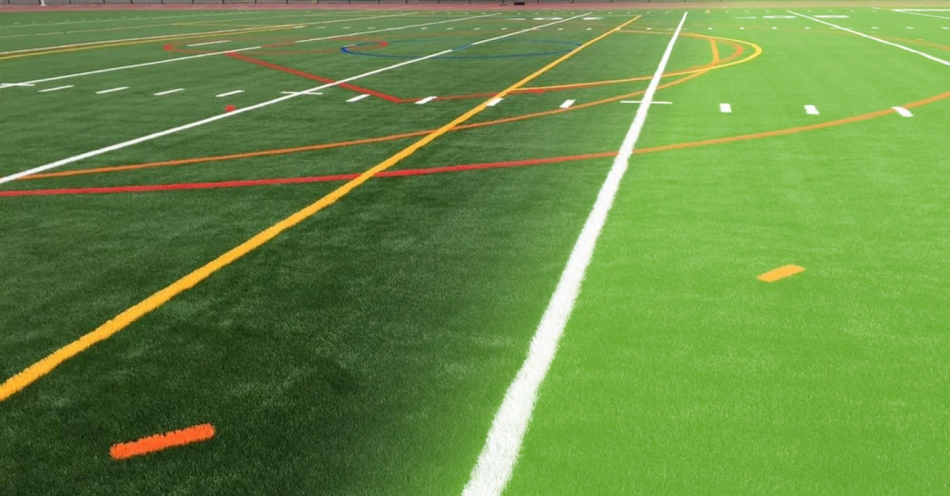 football field with some white yellow and red lines